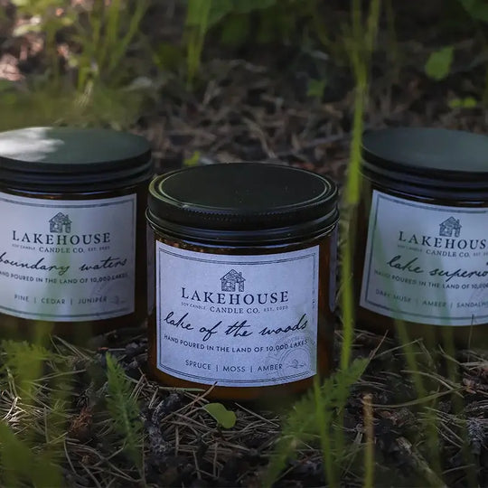 Lakehouse Candle Company Soy Candles featuring three of their candles in the grass
