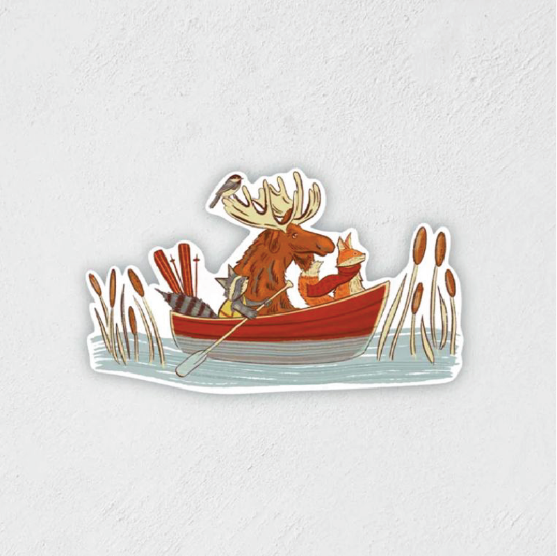 Sticker of a moose, raccoon, and fox riding in a canoe