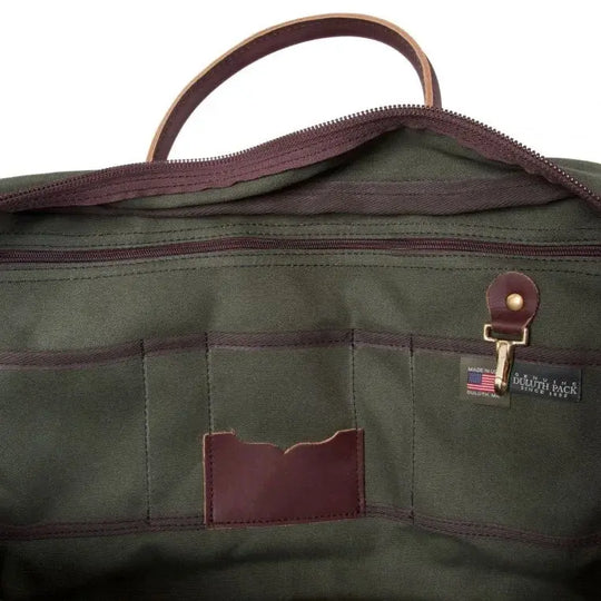The Inside Of The Freelance Briefcase In Olive Drab Green As Seen From The Side On A White Background Showing The Many Slip Pockets, Zipper Pockets, Key Clip, Tags
