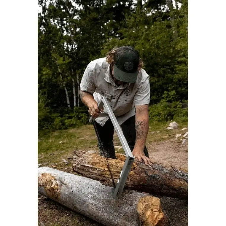 Spring Creek Tuff Camp Saw Being Used To Saw A Large Fallen Tree