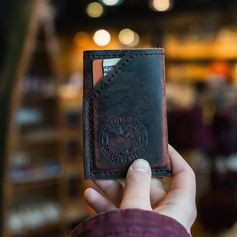 Heritage Leather Card Sleeve held by hand with cards