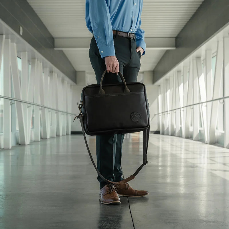 Innovator Briefcase Held by Man in Hallway
